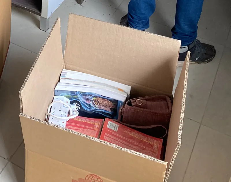 Textbooks packed flat in a Get My Bag carton